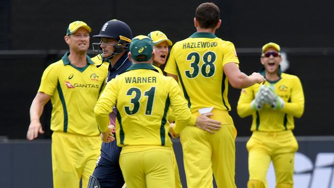 Australia’s players celebrate after the wicket of Jos Buttler. Picture: AAP