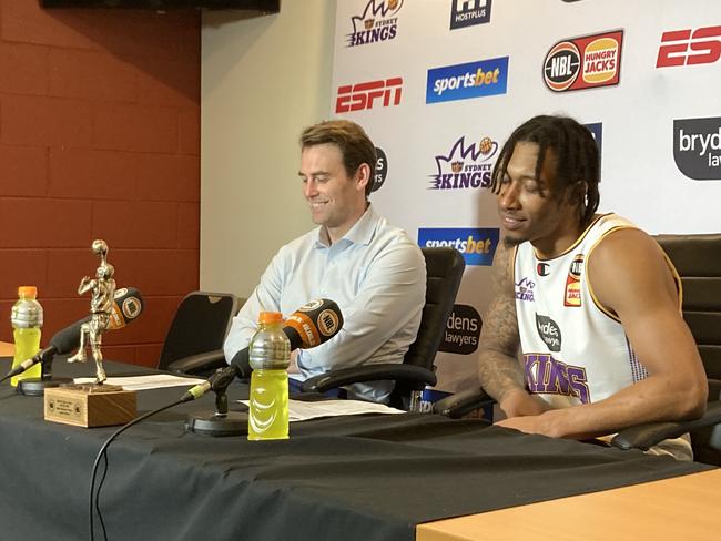 Jaylen Adams, with his MVP trophy in tow — and coach Chase Buford — at the Sydney Kings’ post-win press conference.