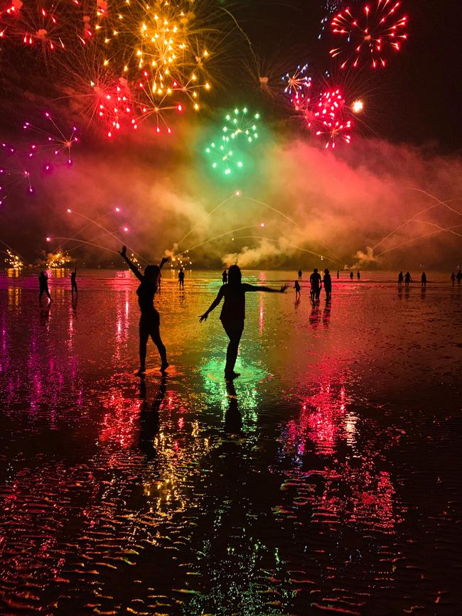 Lily North and Katrina Leembruggen enjoy the fireworks at Mindil Beach. Picture: Supplied