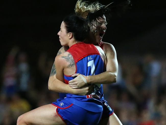 Deanna Berry (7)  of the Bulldogs celebrates the winning goal.  during the Round 7 AFLW match between the Western Bulldogs and the Melbourne Demons at Victoria University, Whitten Oval in Melbourne, Saturday, March 17, 2018. (AAP Image/George Salpigtidis) NO ARCHIVING, EDITORIAL USE ONLY