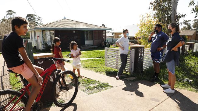 LeaderLife team members stop drop off food parcels in the community. Picture: Chris Pavlich