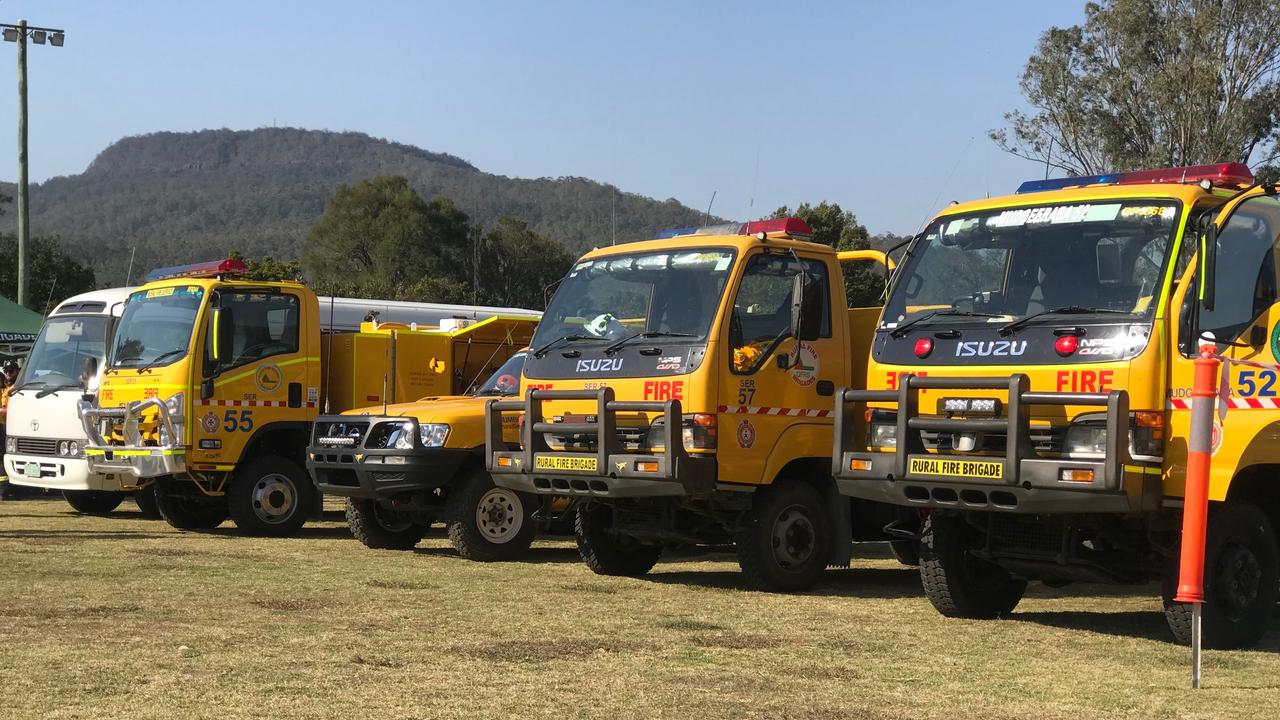 Fire trucks lined up in a row to battle the Sarabah bushfires.