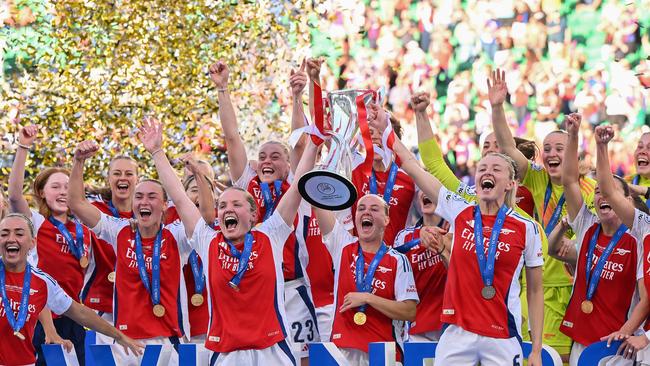 Arsenal lift the UEFA Women's Champions League trophy in Lisbon.