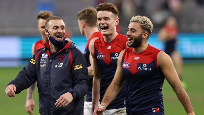 Simon Goodwin shares a moment with Bayley Fritsch and Christian Salem.