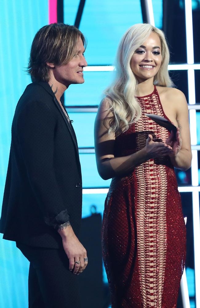 Just an hour later she quickly changed into a red sequined gown to present an award alongside host Keith Urban. Picture: Mark Metcalfe/Getty Images