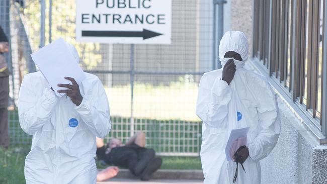 Two men helping police with their inquiries leave Campbelltown Police Station today. Picture: Flavio Brancaleone