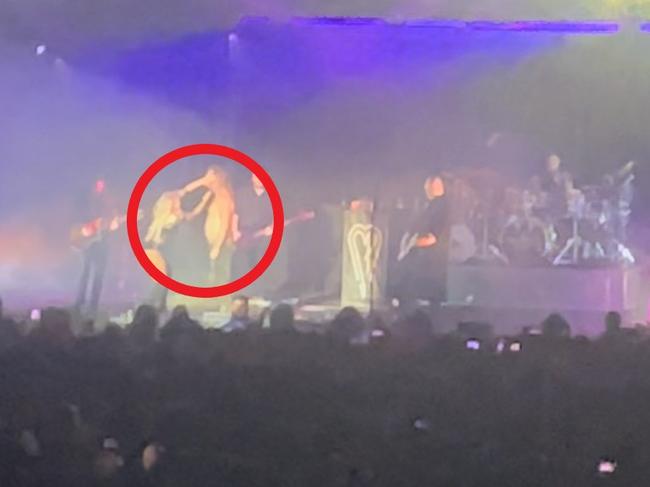 Man decked during rock icon's Sydney set. Picture: Alex Blair