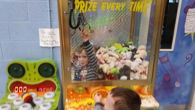 Not happy ... went to great lengths to “win” a toy in the skill-tester. Picture: Facebook