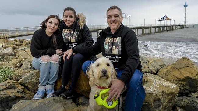 Scottish family Rebecca, left, Kelly and Mark Green with dog Maisie at Brighton Beach, Adelaide. Picture: Roy VanDerVegt