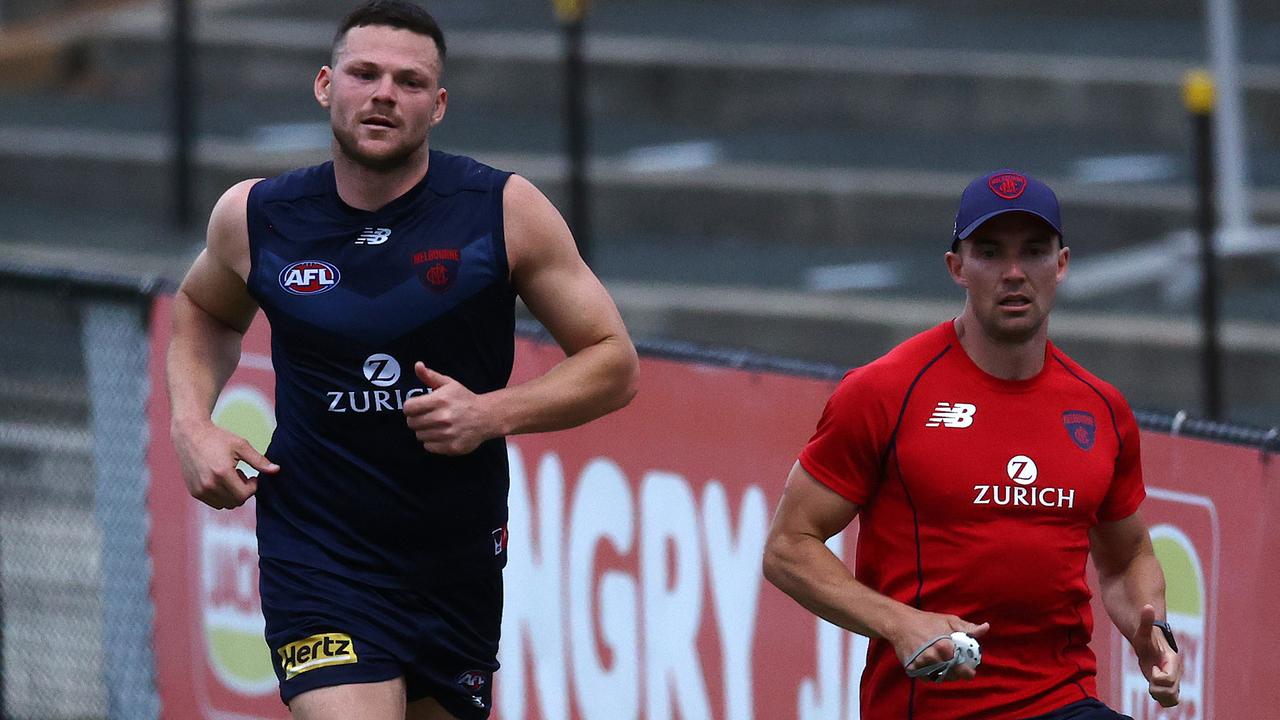 Steven May running laps during todays training session. Picture by Michael Klein