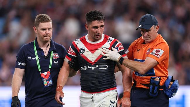 SYDNEY, AUSTRALIA - MARCH 06:  VictorÃÂ Radley of the Roosters is attended to by trainers after a head clash with James Tedesco of the Roosters during the round one NRL match between Sydney Roosters and Brisbane Broncos at Allianz Stadium on March 06, 2025, in Sydney, Australia. (Photo by Cameron Spencer/Getty Images)