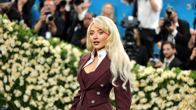 Sabrina Carpenter turned heads in a striking burgundy Louis Vuitton bodysuit. Picture: Getty