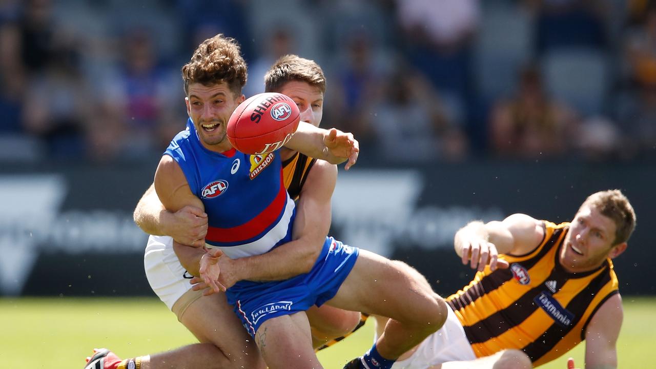 Tom Liberatore of the Bulldogs is tackledduring the AFL JLT Community Series match between the Western Bulldogs and the Hawthorn Hawks at Mars Stadium on March 3, 2018 in Ballarat, Australia. (Photo by Scott Barbour/Getty Images)