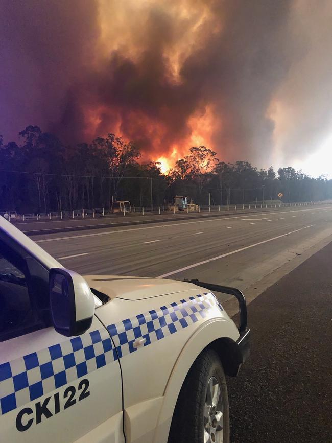 Police near a fire at New Italy, on the NSW north coast.