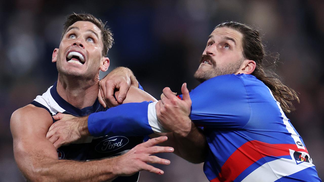 Josh Bruce (right) wrestles with Tom Hawkins. Picture: Mark Stewart