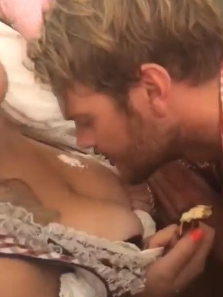 Jack Watts snorting a white substance off a woman's breast.