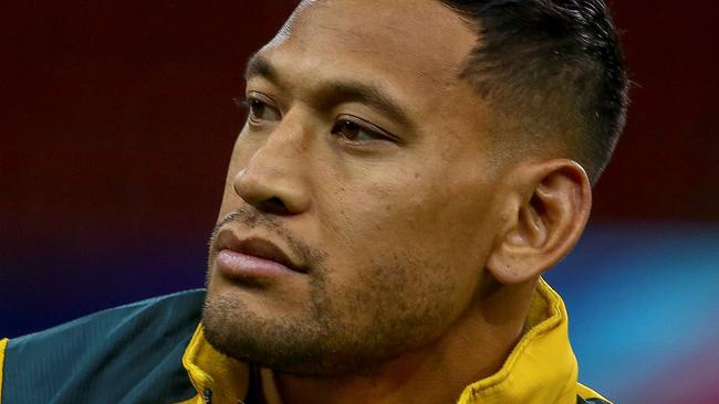 (FILES) In this file photo taken on November 9, 2018, Australia's wing Israel Folau attends the captain's run training session at the Principality stadium in Cardiff, south Wales, on the eve of their autumn international rugby union match against Wales. - Sacked Wallabies fullback Israel Folau launched legal action on June 6, 2019 against Rugby Australia's decision to dismiss him over homophobic social media posts, saying he was seeking "substantial remedies" from the governing body. Folau's contract was terminated in May after a Rugby Australia tribunal found him guilty of a "high-level" code of conduct breach for posting on social media that "hell awaits" gay people and others he considers sinners. (Photo by GEOFF CADDICK / AFP) / RESTRICTED TO EDITORIAL USE -use in books subject to Welsh Rugby Union (WRU) approval