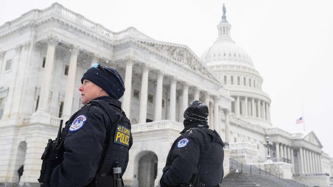 US Capitol Police officers stand watch outside the US Capitol building as congress certifies the results of the 2024 Presidential election. Picture: AFP