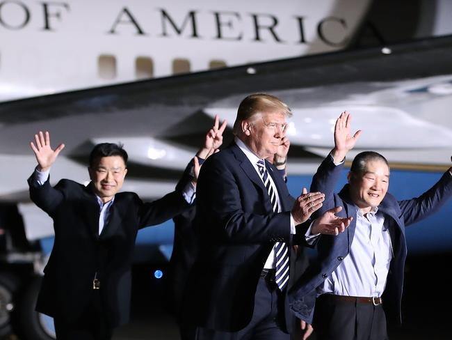 JOINT BASE ANDREWS, MD - MAY 10: U.S. President Donald Trump walks with the three Americans just released from North Korea, Kim Dong Chul, Kim Hak-song and Tony Kim at Joint Base Andrews on May 9, 2018 in Maryland. Secretary of State Mike Pompeo traveled to North Korea and returned with the three men who had been detained for up to two years. The three U.S. citizens have been released as a goodwill gesture ahead of a planned summit between Trump and Kim Jong Un.  Mark Wilson/Getty Images/AFP. (Photo by Mark Wilson/Getty Images) == FOR NEWSPAPERS, INTERNET, TELCOS & TELEVISION USE ONLY ==