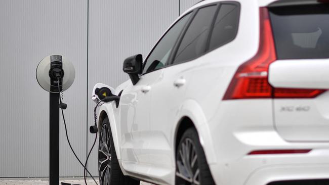 A Volvo XC60 hybrid car plugged into a charging point outside a Volvo dealership. Picture: AFP