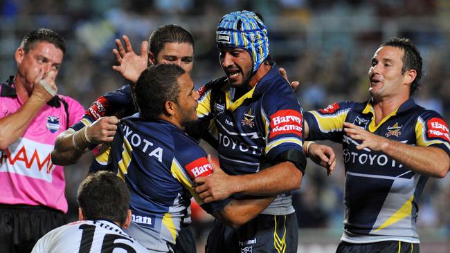 Johnathan Thurston congratulates Matt Bowen after he scores a try for the Cowboys.