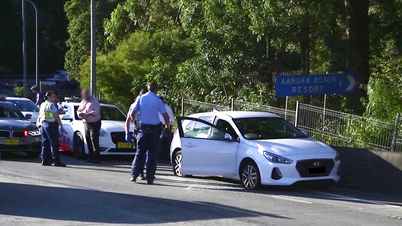 Officers from Coffs/Clarence Traffic and Highway Patrol following an alleged high speed pursuit which started at Glenugie and ended near the Big Banana at Coffs Harbour. Photo: Frank Redward