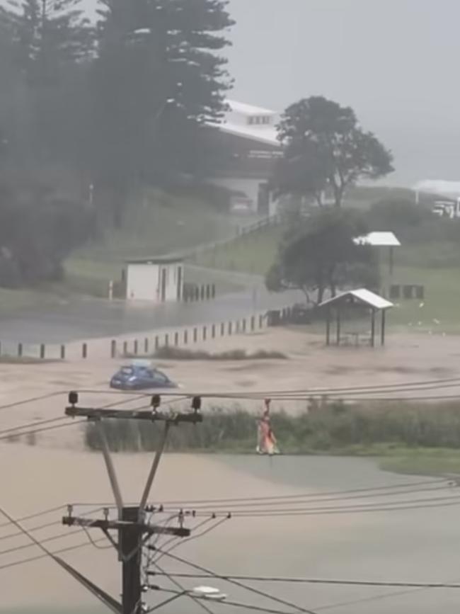 A car can be seen floating out towards the ocean in Stanwell Park, south of Sydney. Picture: Facebook