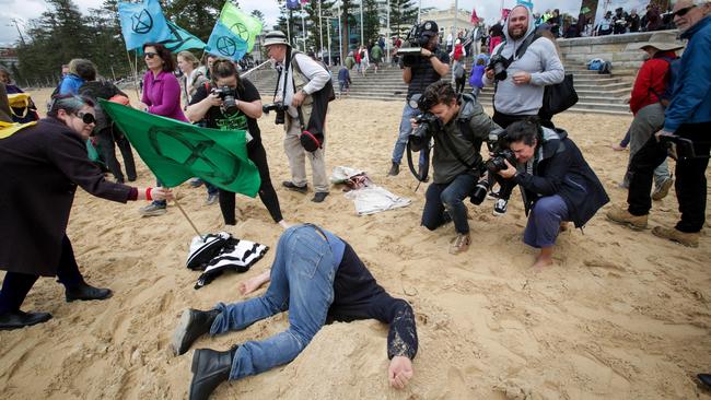 Matt Parmeter of Dubbo buries his head in the sand at the event. Picture: Liam Driver