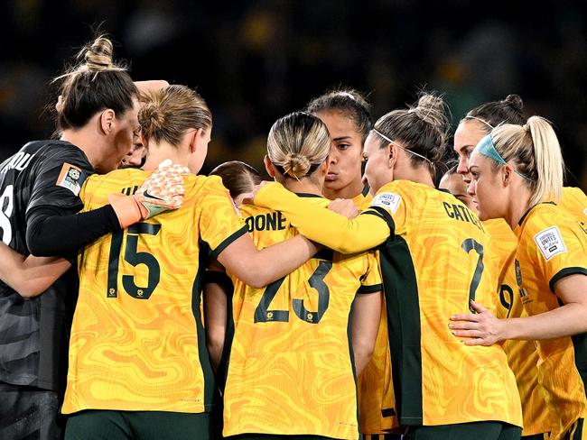 SYDNEY, AUSTRALIA - JULY 20: The Matildas players embrace during the FIFA Women's World Cup Australia & New Zealand 2023 Group B match between Australia and Ireland at Stadium Australia on July 20, 2023 in Sydney, Australia. (Photo by Bradley Kanaris/Getty Images)