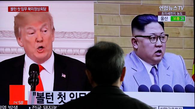 FILE - In this March 27, 2018, file photo, a man watches a TV screen showing file footages of U.S. President Donald Trump, left, and North Korean leader Kim Jong Un, right, during a news program at the Seoul Railway Station in Seoul, South Korea. As the U.S.-North Korea summit looms, President Donald Trumpâ€™s policy of maximum pressure on North Korea may be working - thanks to China. Beijing appears to have gone well beyond U.N. sanctions on its unruly neighbor, reducing its total imports from North Korea in the first two months this year by 78.5 and 86.1 percent in value. (AP Photo/Lee Jin-man)