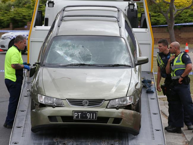 A car believed to be involved in the incident is loaded onto a truck for further investigation. Picture: David Crosling