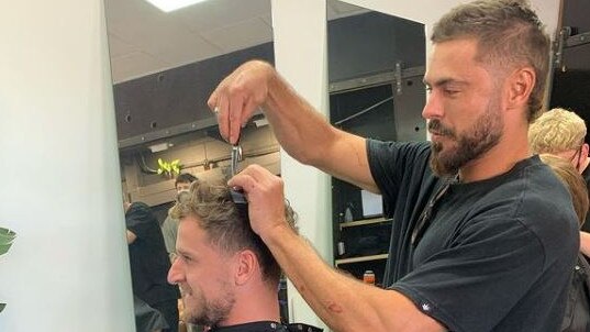 Zac Efron, complete with mullet, tried his hand at hairdressing in Adelaide. Picture: Instagram