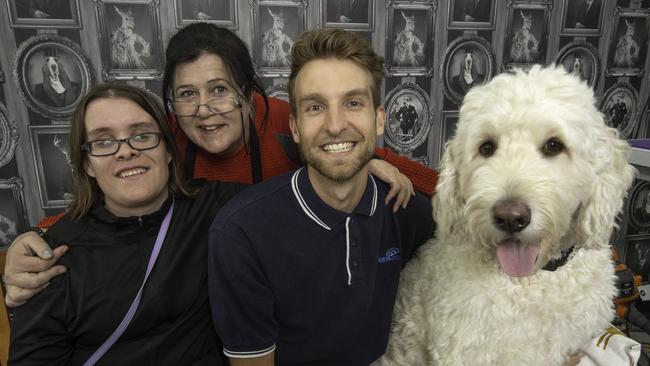 Giving thanks: Kirstie Loughton and Louise Grogan meet call taker Nick Buruma at their Moonee Ponds dog salon. Picture: Tony Gough