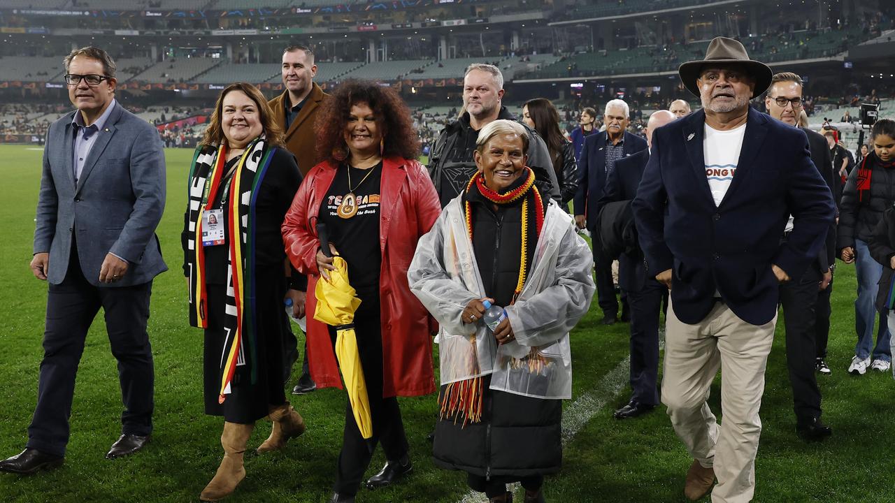 Michael Long (far right) and others finishing The Long Walk to the MCG. Picture: Michael Klein