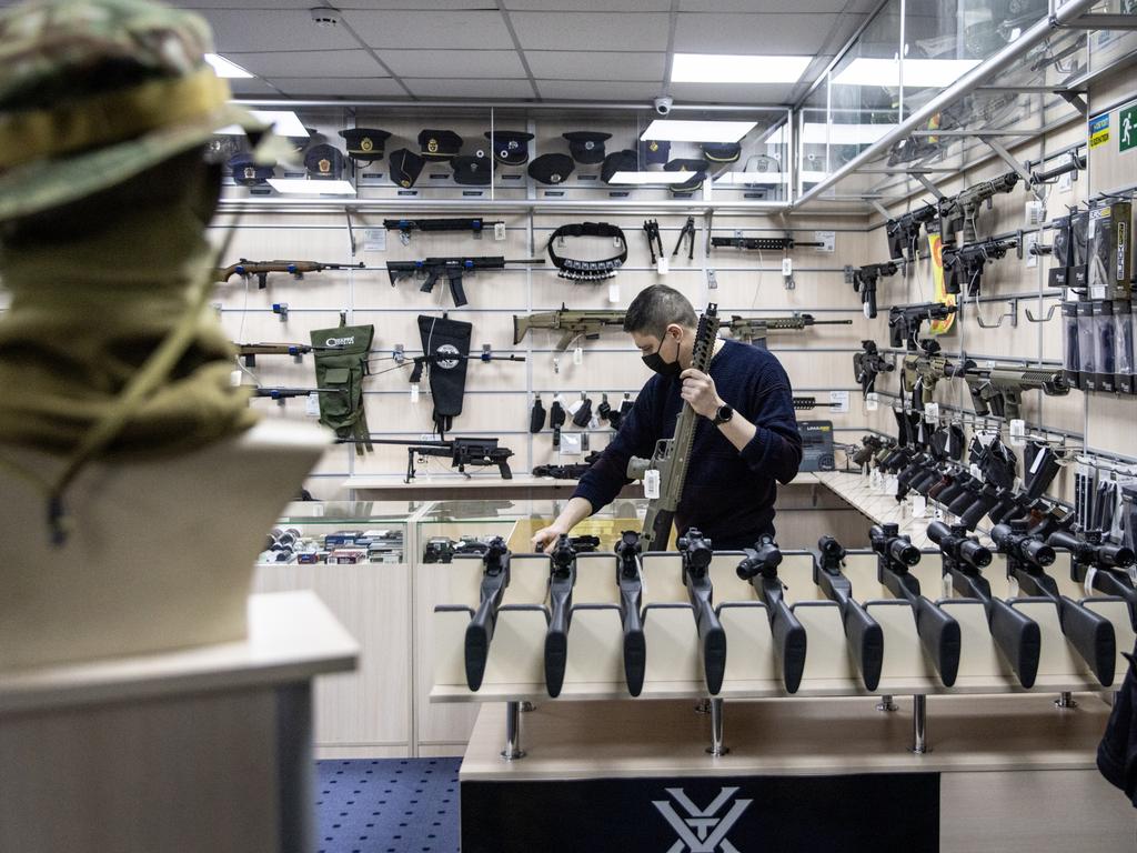 An employee works at the gun counter of a tactical equipment shop in Kyiv, Ukraine. Picture: Getty Images