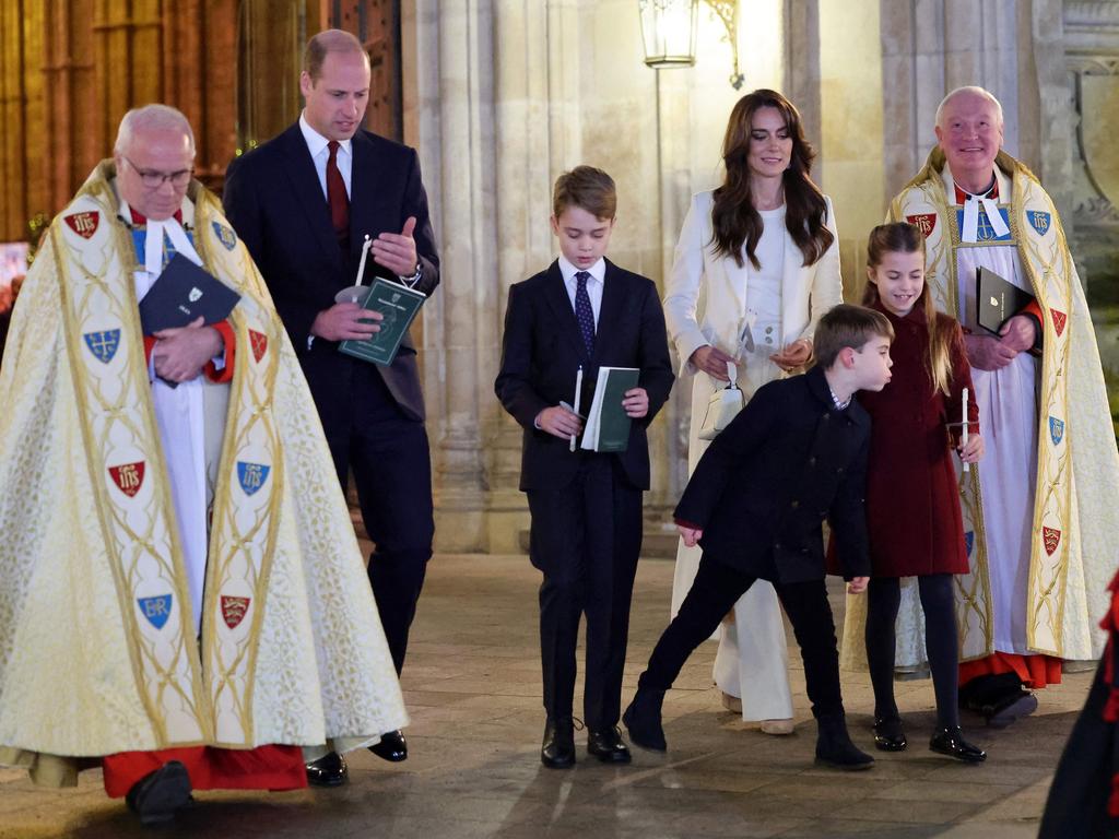 Britain's Princess Charlotte of Wales (2R) has her candle blown out by Britain's Prince Louis of Wales (3R) at the "Together At Christmas" Carol Service" at Westminster Abbey in London on December 8, 2023. The event will be broadcast as part of 'Royal Carols: Together At Christmas', a special programme, airing at 7:45pm on ITV1 and ITV X on Christmas Eve. (Photo by Chris Jackson / POOL / AFP)