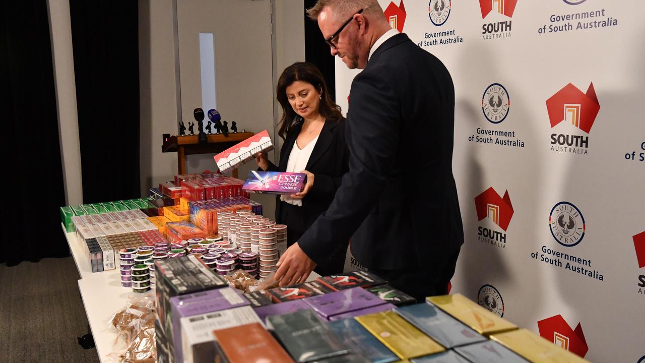 Consumer and Business Affairs Minister Andrea Michaels and Commissioner for Consumer Affairs Brett Humphrey with CBS' biggest illicit tobacco bust with $1 million worth of product seized at a single store. Picture: Keryn Stevens.