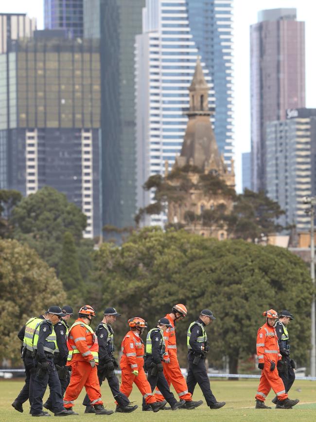 Police and SES conduct a line search of the area yesterday. Picture: David Crosling