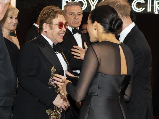 ‘One of my dearest friends.’ Sir Elton Johh, left, is close with the royal couple. Picture: Getty Images