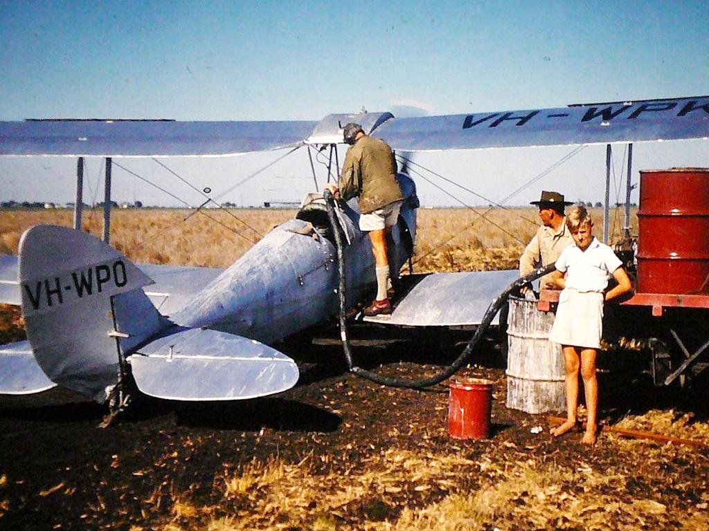 Loading a plane with DDT to spray grubs in linseed crops at Pirrinuan 1956.