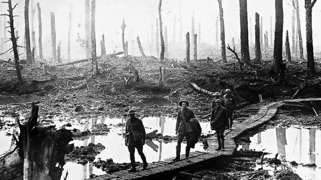 Australian soldiers cross a duckboard track winding through devastated Chateau Wood in the Ypres sector of France in 1917, during WWI. Picture: The Australian War Memorial