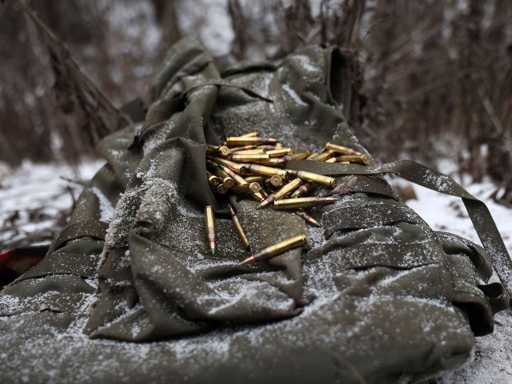 This photograph shows cartridges which laid unloaded from a bag of a wounded soldier on a road side not far from Soledar, Donetsk region on January 14, 2023. Picture: AFP
