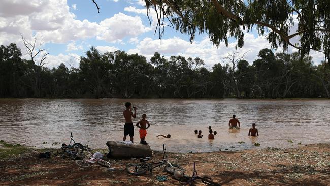 Children play in the Warrego River. Picture: David Kelly