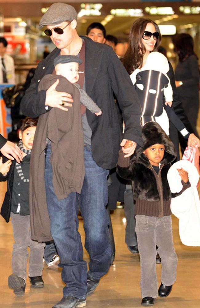 Travelling ... Brad Pitt and Angelina Jolie with their children at Narita International Airport, Japan in 2009. Picture: Supplied