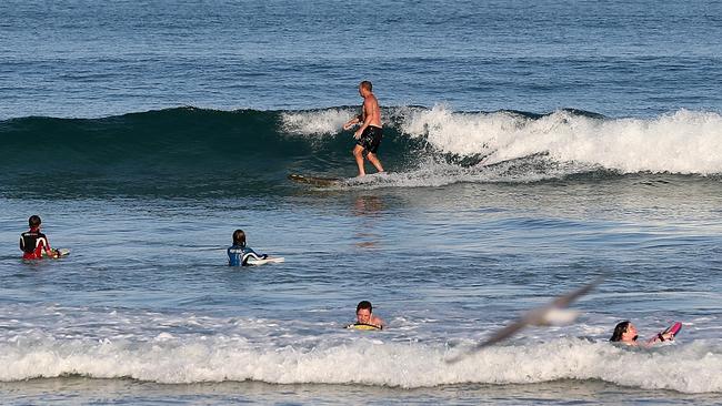 Surfers and swimmers enjoying the ocean at Lorne Beach. Picture: Mark Stewart