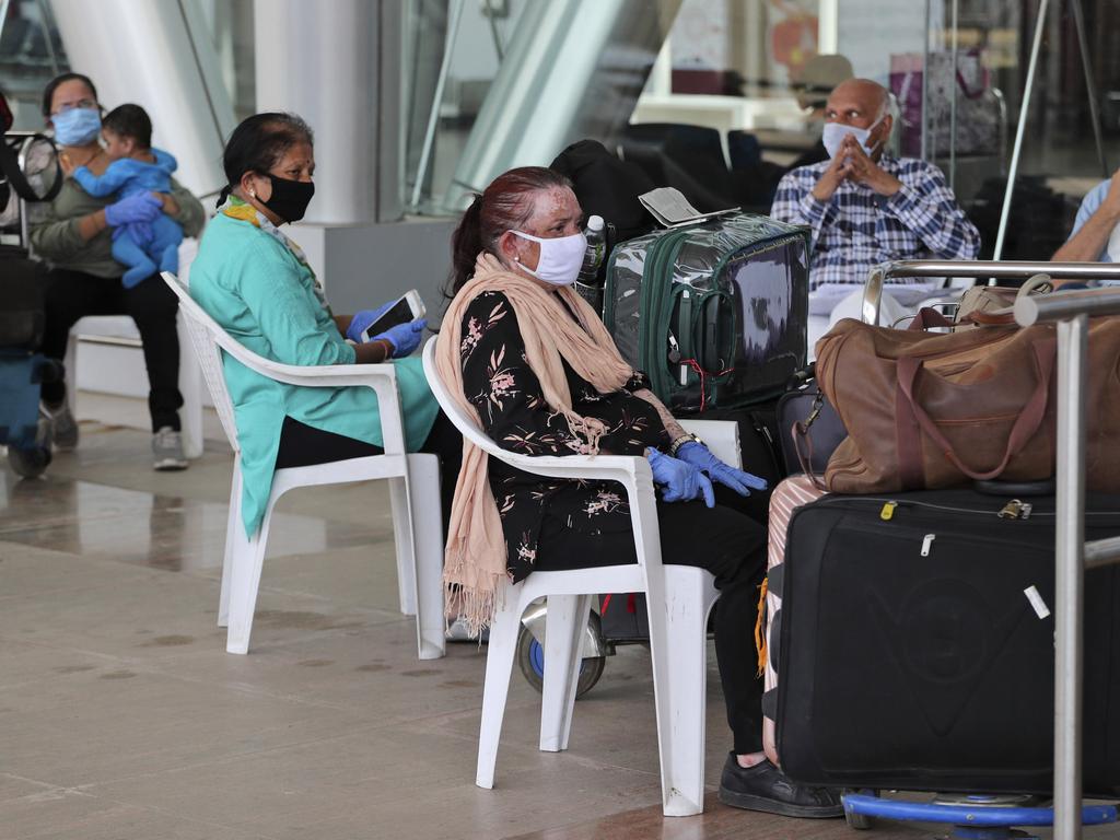 British nationals wait to board a flight to London in India. Picture: AP Photo/Ajit Solanki