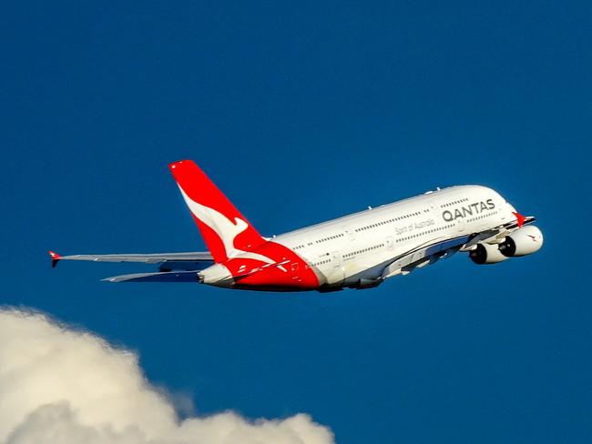 A Qantas Airbus A380-842, registration VH-OQK, has taken off to the west from Sydney Kingsford-Smith Airport and climbing above the clouds.  She is heading to Singapore as flight QF1.  This image was taken from Nigel Love Bridge off Airport Drive, Mascot on a sunny and windy afternoon on 8 April 2023.Escape 16 June 2024Why I TravelPhoto - iStock