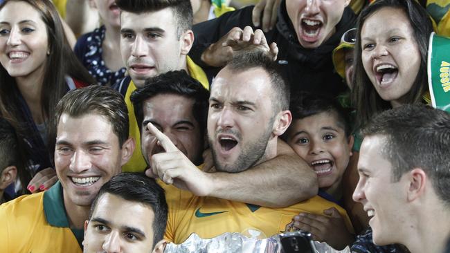 Ivan Franjic celebrates the Socceroos’ triumph with fans.