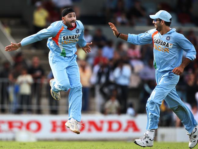 India's Harbhajan Singh celebrates his wicket of Kumar Sangakkara with teammate Yuvraj Singh. Photo: Phil Hillyard.