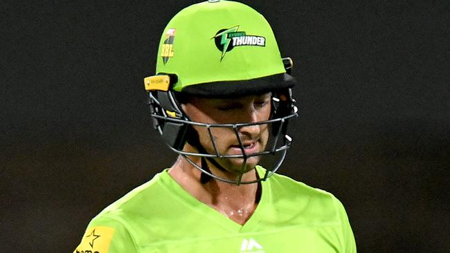 BRISBANE, AUSTRALIA - JANUARY 04: Daniel Sams of the Thunder looks dejected after losing his wicket during the Big Bash League match between the Brisbane Heat and the Sydney Thunder at The Gabba, on January 04, 2021, in Brisbane, Australia. (Photo by Bradley Kanaris/Getty Images)